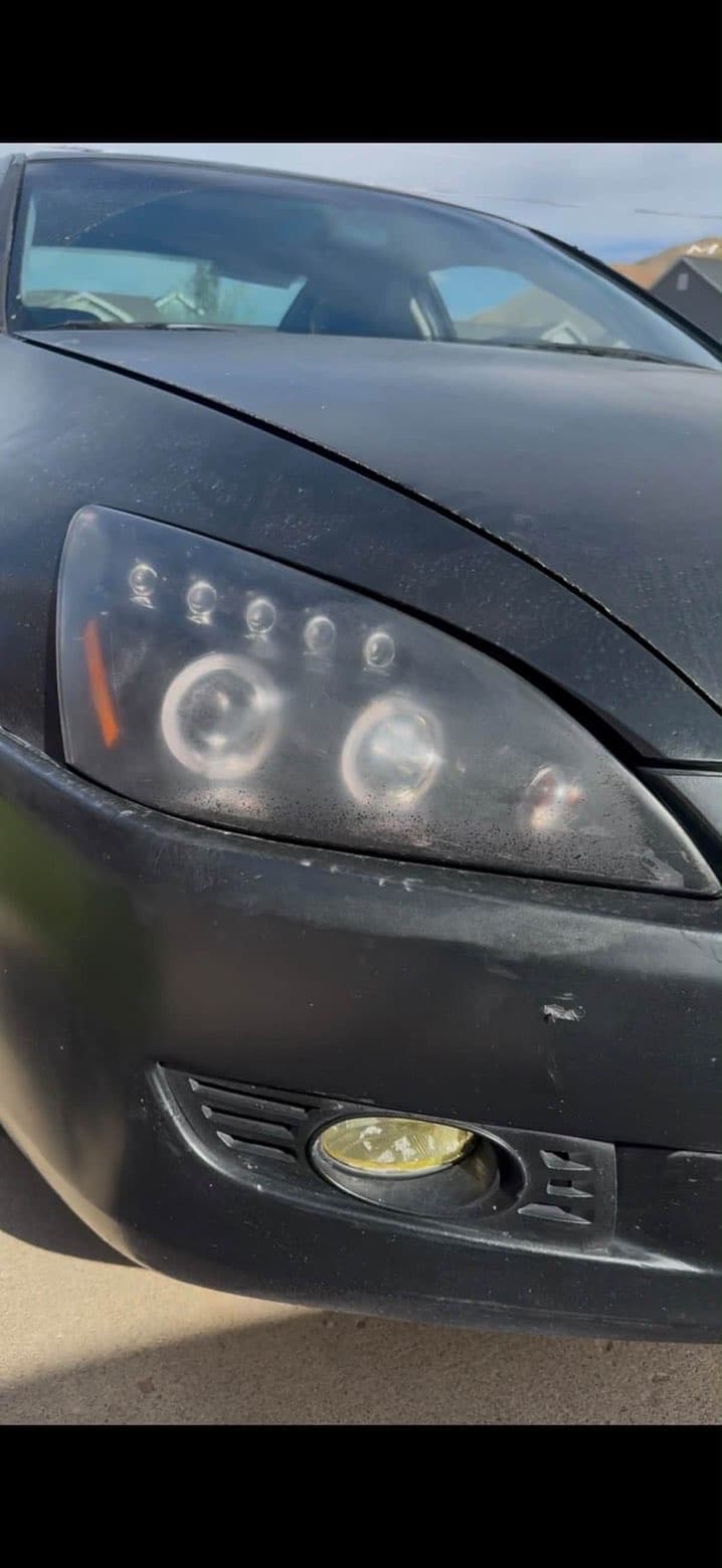 Black car headlight before restoration, cloudy lens